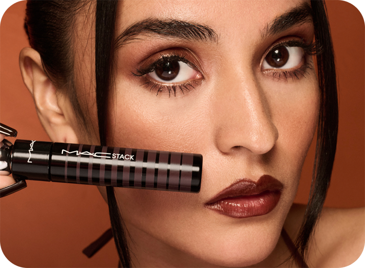 10% off your first order with model holding mascara next to her face
