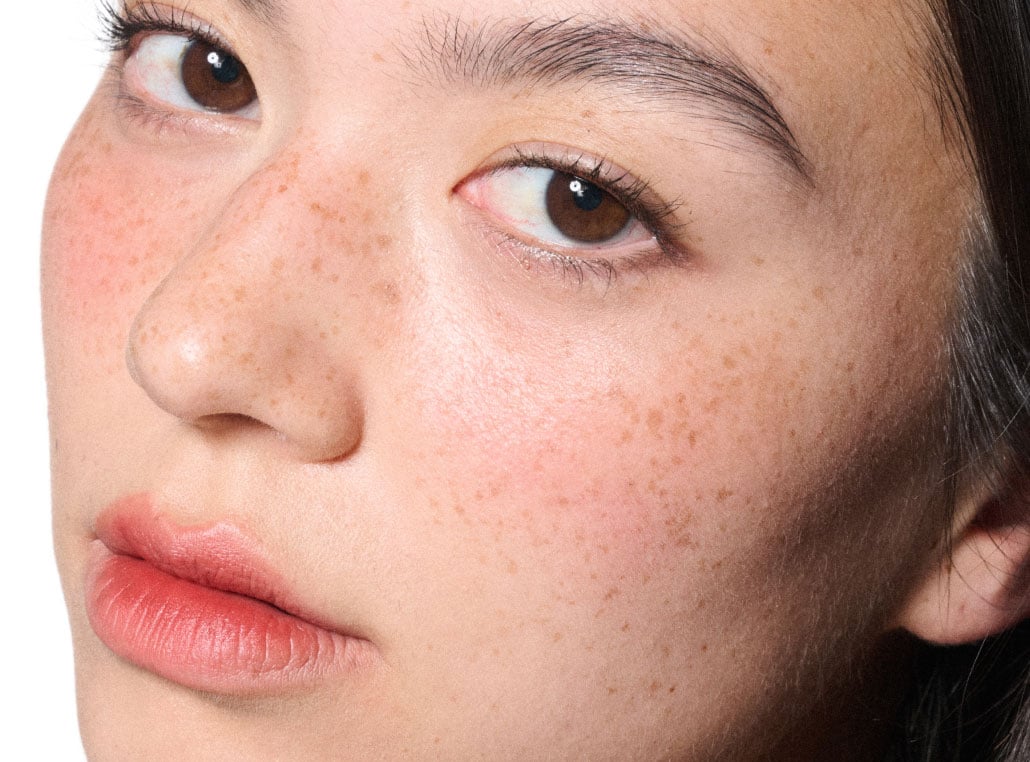 Model wearing Devoted to Chili shade on lips and cheeks