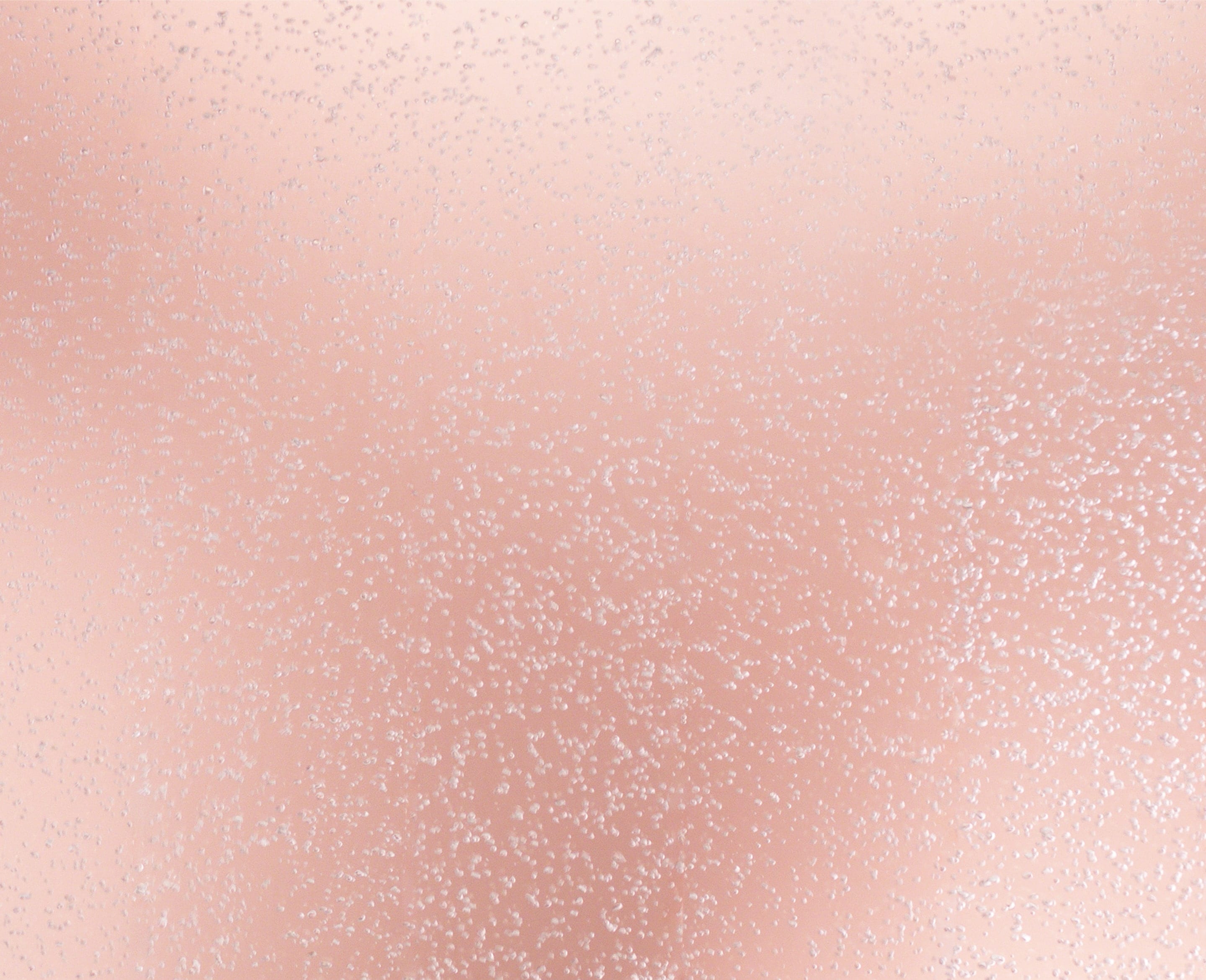 Background image containing bubbles over a soft pink background